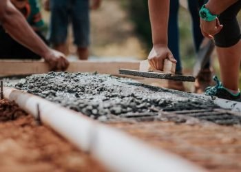 labor_or_labour_putting_cement_as_foundation_of_a_structure labor_or_labour_putting_cement_as_foundation_of_a_structure