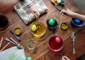 people_holding_silver_spoons_with_colored_eggs people_holding_silver_spoons_with_colored_eggs